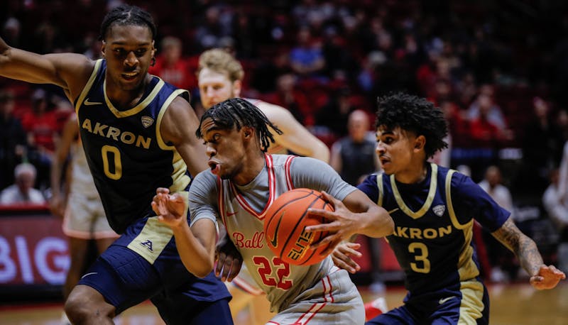 Ball State freshman guard T.J. Burch drives with the ball against Akron Feb. 25 at Worthen Arena. Burch had seven points for the Cardinals. Andrew Berger, DN 