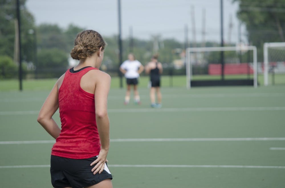 Freshman Carley Shannon rests after running during practice on Aug. 26 at Briner Sports Complex. Transitioning from high school to college has helped her learn a lot about field hockey. DN PHOTO BREANNA DAUGHERTY