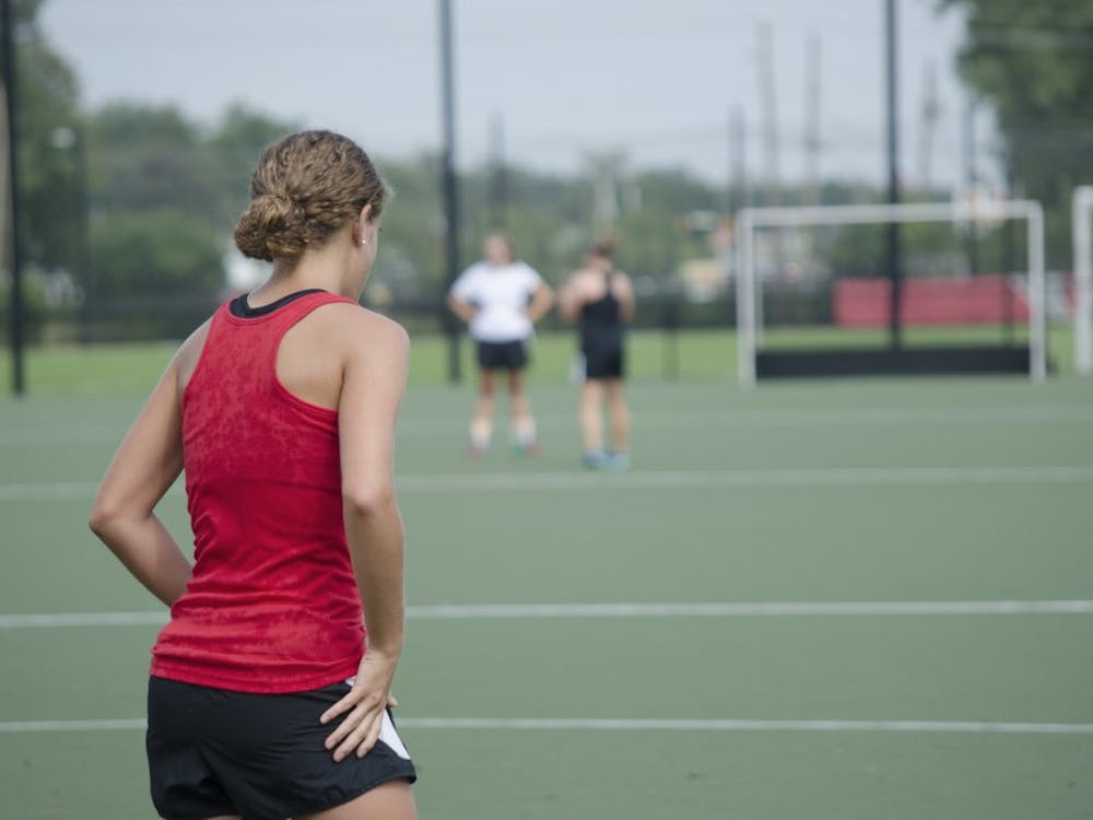 Freshman Carley Shannon rests after running during practice on Aug. 26 at Briner Sports Complex. Transitioning from high school to college has helped her learn a lot about field hockey. DN PHOTO BREANNA DAUGHERTY
