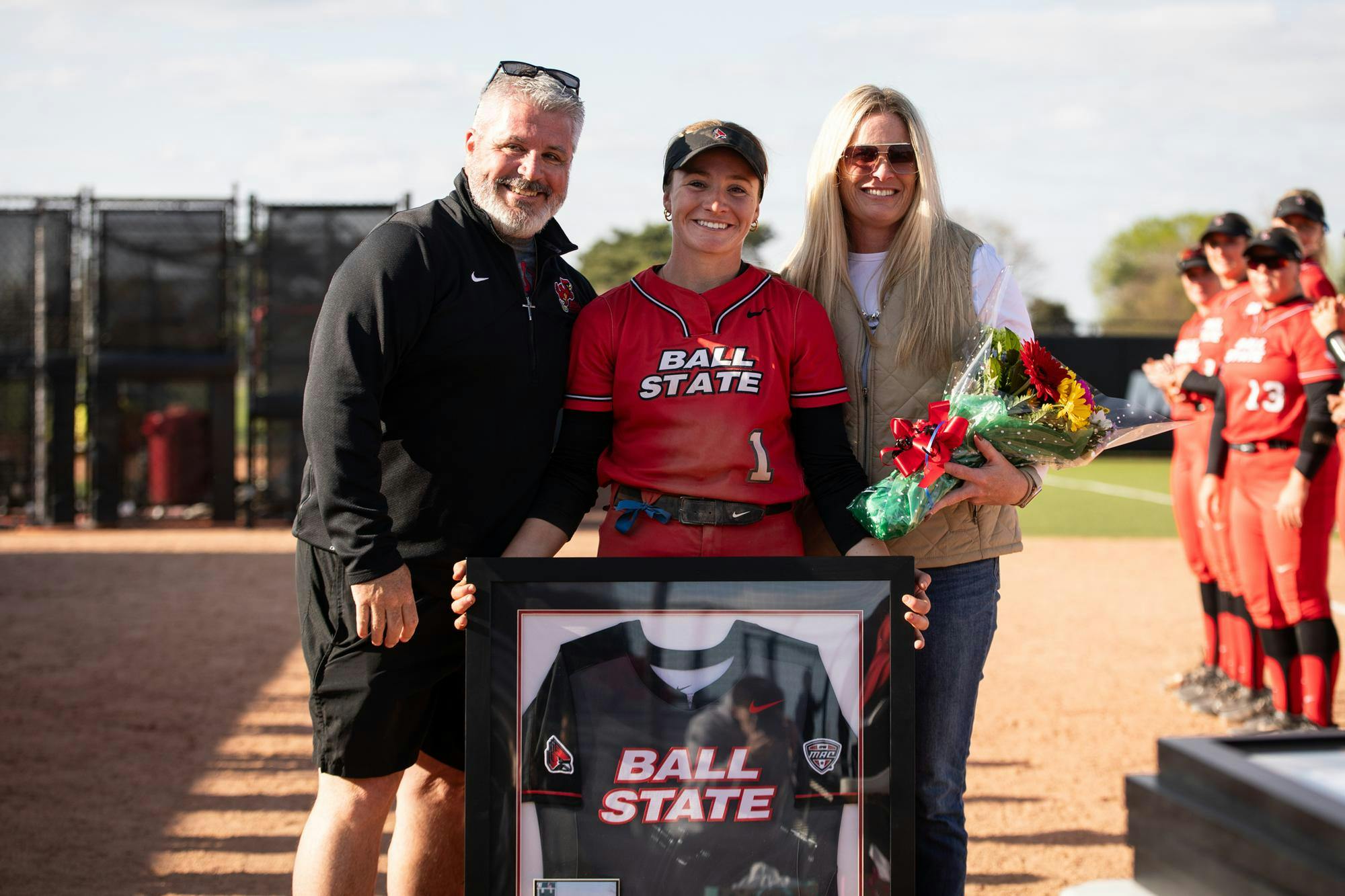 Senior McKenna Mulholland poses with her mother and guardian angel during senior day April 26 at Ball State Softball Stadium. Andrew Berger, DN 