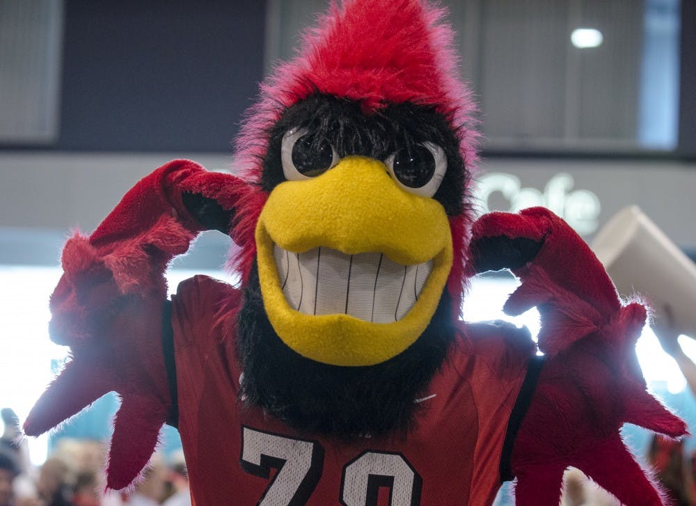 Charlie Cardinal tries to rally the crowd during the mayor's luncheon Jan. 3 at the Mobile Convention Center in Mobile, Ala. DN PHOTO COREY OHLENKAMP