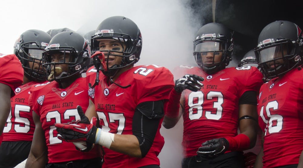Members of the Ball State football team get ready to take the field before the start of the home opener against Colgate on Aug. 20 at Scheumann Stadium. DN PHOTO BREANNA DAUGHERTY 