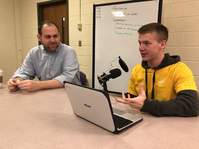 Muncie Central High School Social Studies Teacher Drew Shermeta and senior Matt Lloyd show off the technology Shermeta was able to buy for students due to a grant from The Community Foundation of Muncie and Delaware County Inc. Brooke Kemp, DN