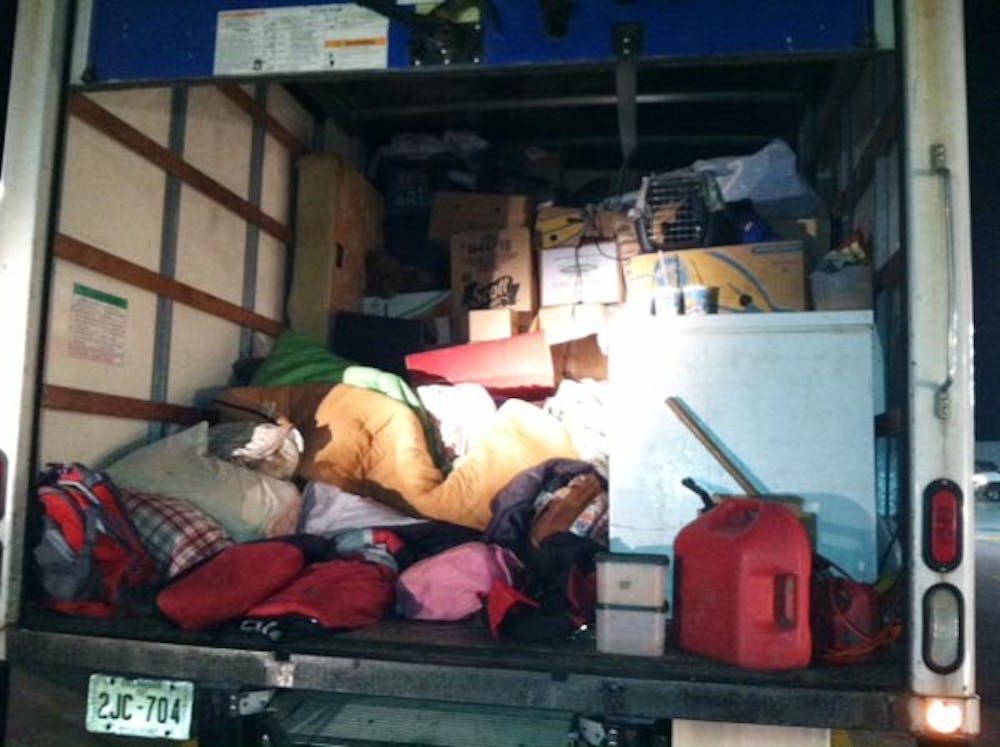 Featured is the back of a moving truck that held four children, an 18-year-old daughter and 18 cats. The truck had been pulled over at the Flying J truck stop located at the New Castle, Ind., exit of Interstate 70. The upper right side stack of boxes is where State Trooper Nick Razor found two of the children riding on the top of the stack in sleeping bags. PHOTO PROVIDED BY THE INDIANA STATE POLICE