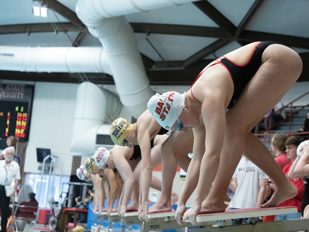 Junior Neely Agnew, Junior Eliza Bader, and Senior Laura Wright preapres to launch off for 100 meters Breastroke at the meet against Toledo Jan. 20 at Lewellen Aquatic Center. Ball State Women's Swim won 182-117. Kate Tilbury, DN