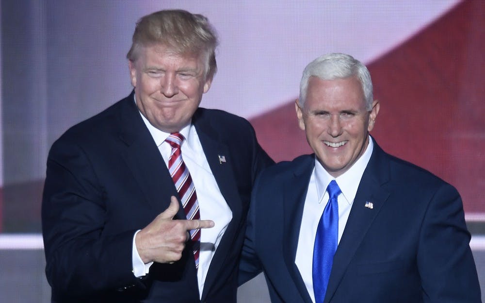 Republican presidential nominee Donald Trump appears on stage with vice presidential choice Mike Pence on the third day of the Republican National Convention at Quicken Loans Arena in Cleveland on Wednesday, July 20, 2016. (Olivier Douliery/Abaca Press/TNS)