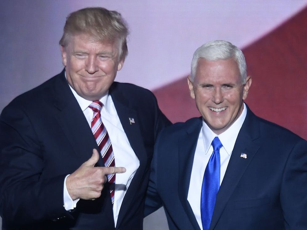 Republican presidential nominee Donald Trump appears on stage with vice presidential choice Mike Pence on the third day of the Republican National Convention at Quicken Loans Arena in Cleveland on Wednesday, July 20, 2016. (Olivier Douliery/Abaca Press/TNS)