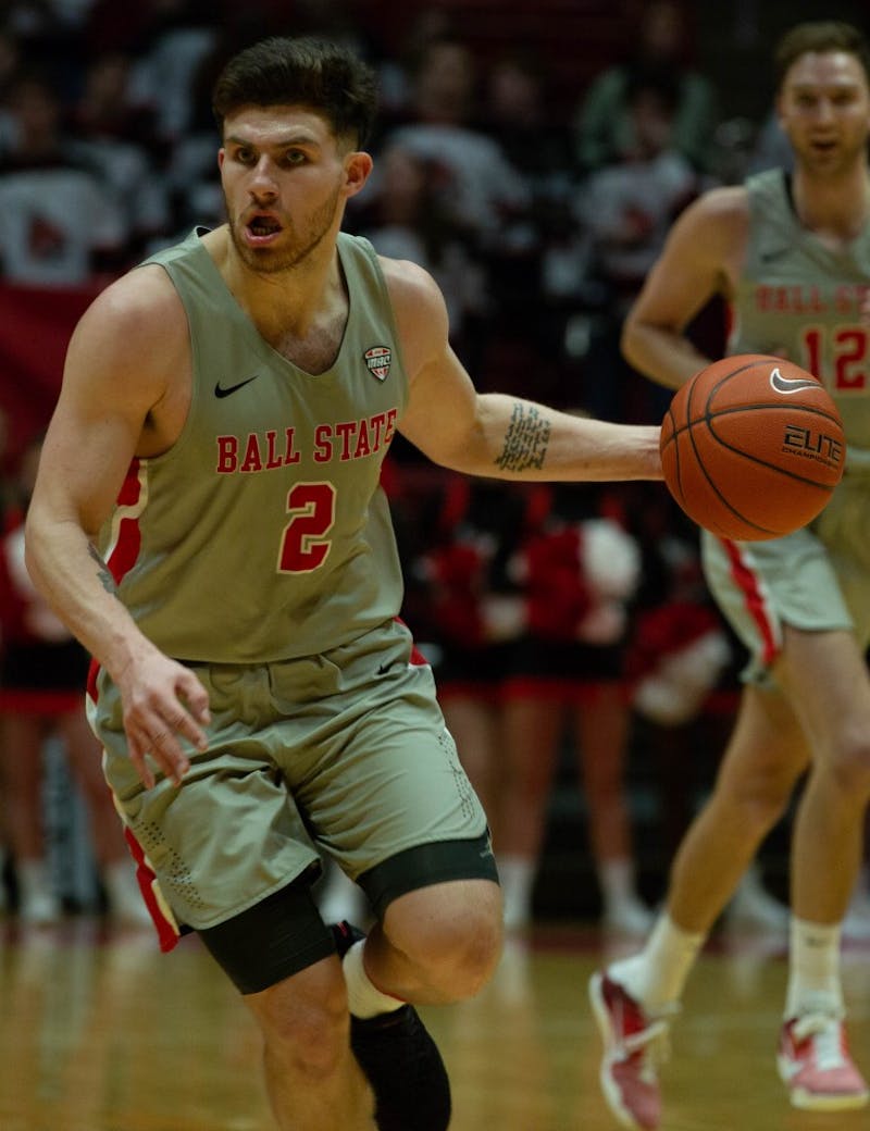 Redshirt senior guard Tayler Persons moves with the ball during the game against the University of Akron Feb. 16, 2019 in John E. Worthen Arena. Ball State defeated Akron 57-56. Scott Fleener, DN