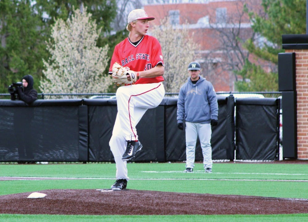<p>Sophomore right-handed pitcher Brendan Burns prepares to throw a pitch to a Western Michigan player during the game on April 10 at Ball Diamond. DN PHOTO PATRICK MURPHY</p>