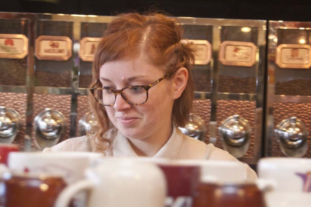 Ryn Pee makes a hot chocolate for one of The Cup’s customers. Ryn and her siblings Becca and Brendon work morning shifts at The Cup making baked goods, coffee, soup and breakfast sandwiches. DN PHOTO RJ RICKER
