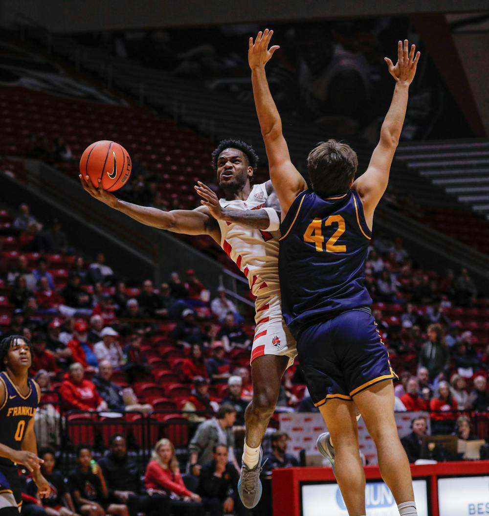 <p>Junior guard Jermahri Hill jumps to the basket for a lay up against Franklin College Nov. 8 at Worthen Arena. Hill had three rebonds for the Cardinals. Andrew Berger, DN </p>