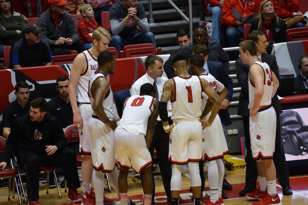 Head Coach James Whitford talkes to his players during a timeout at the game against Northern Illinois on Feb. 19 in Worthen Arena. DN PHOTO KORINA VALENZUELA