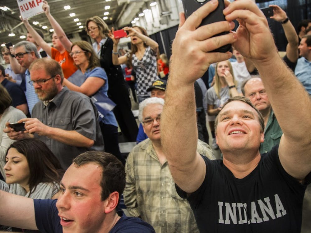 Taking a selfie just before Donald Trump's loud introduction at April 20 rally in Indianapolis. DN PHOTO/TRENT SCROGGINS