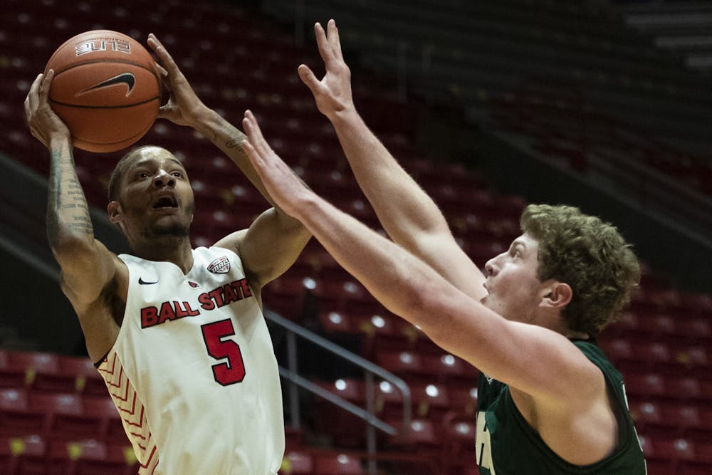 3Ball State Cardinals senior guard Ishmael El-Amin shoots the ball while being guarded during the first half of a game against the Ohio University Bobcats Jan. 2, 2020, at John E. Worthen Arena. The Cardinals lost the Bobcats 78-68. Jacob Musselman, DN