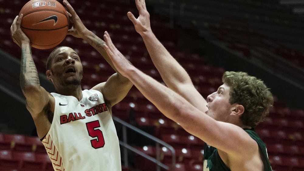 3Ball State Cardinals senior guard Ishmael El-Amin shoots the ball while being guarded during the first half of a game against the Ohio University Bobcats Jan. 2, 2020, at John E. Worthen Arena. The Cardinals lost the Bobcats 78-68. Jacob Musselman, DN