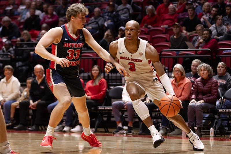 Senior #3 Mickey Pearson JR goes around a Detroit Mercy defender on Nov 20 at Worthen Arena. Ball state lost 59-70. Titus Slaughter, DN.