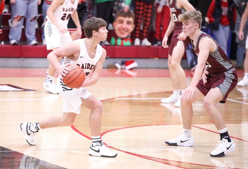 Wapahani senior Nate Luce looks to pass Dec. 20 against Wes-Del at Wapahani High School. Luce finished with 16 points. Zach Carter, DN.