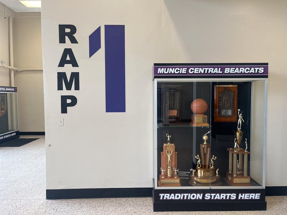 A trophy case with three boys' basketball state championship trophies is displayed outside the Muncie Fieldhouse Sunday, April 7. The Bearcats have won eight state championships, all between the 1920s and 1980s. Kyle Smedley, DN