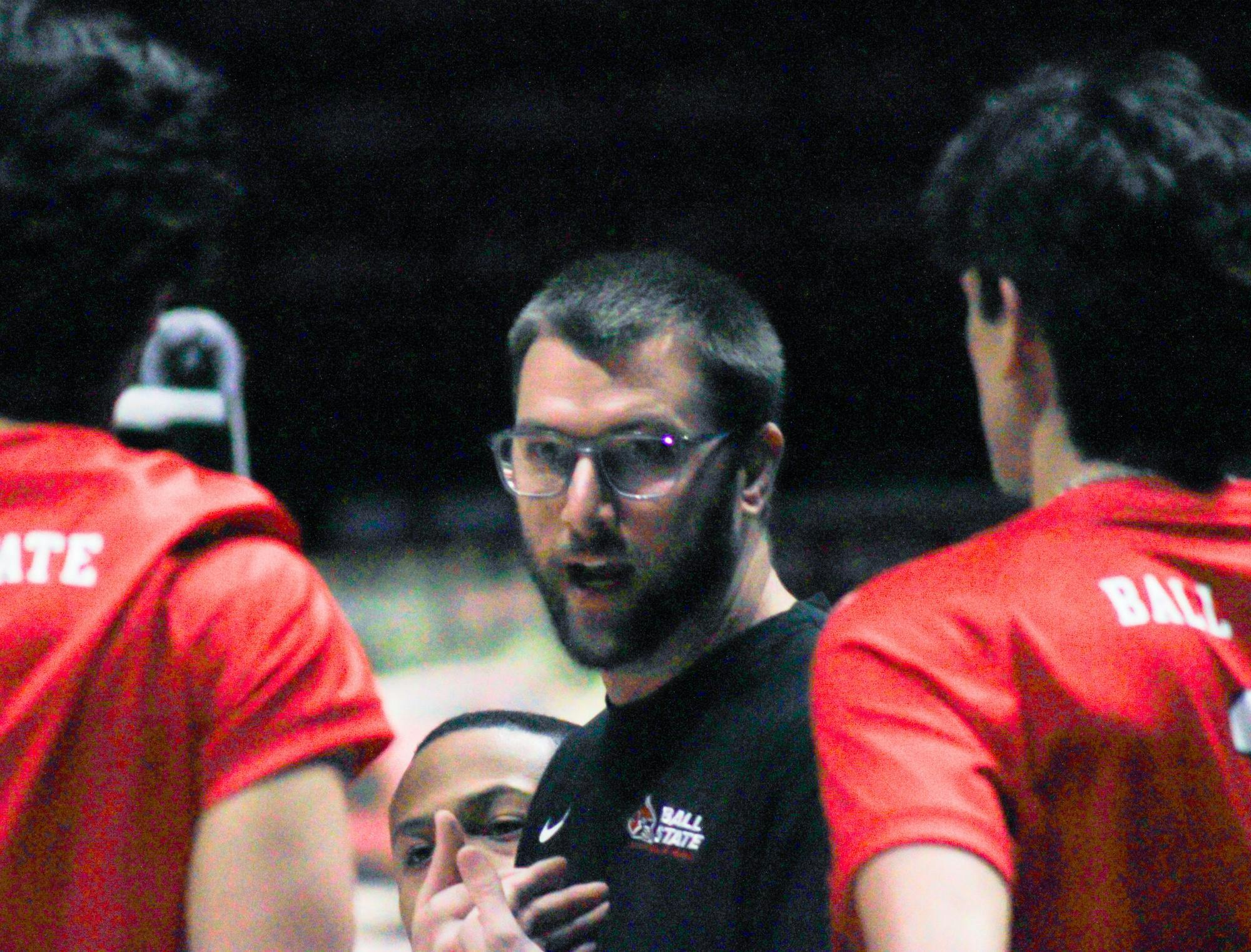 Ball State men's volleyball Head Coach Mike Iandolo discusses the game with the players Jan. 10 in Worthen Arena. Branden Woods, DN