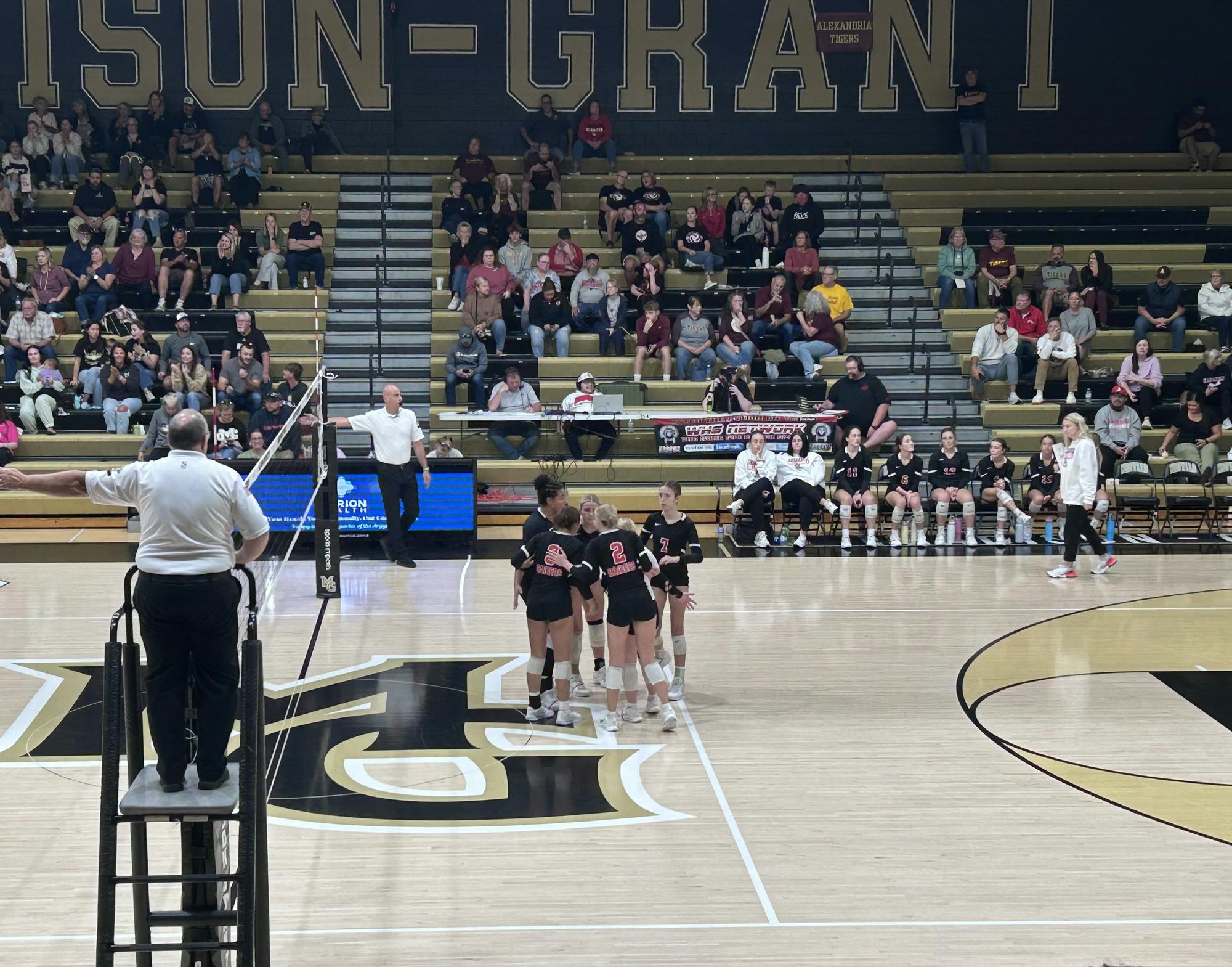 The raiders regroup after scoring. Waphani sweeps Madison-Grant 3–0. Photo by Kenna Geibel 
