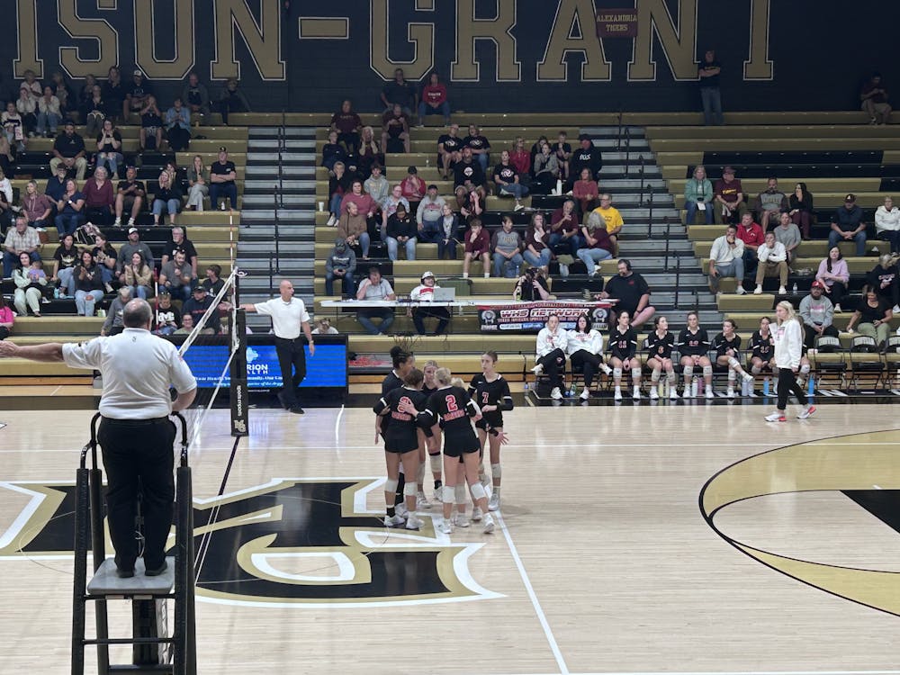 The raiders regroup after scoring. Waphani sweeps Madison-Grant 3–0. Photo by Kenna Geibel