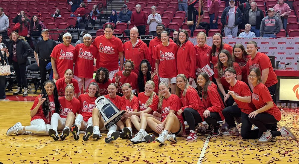 <p>The 2024-25 Ball State women's basketball team poses with the Mid-American Conference (MAC) regular season trophy. The Cardinals won the title after defeating Buffalo 72-60. Elijah Poe, DN</p>