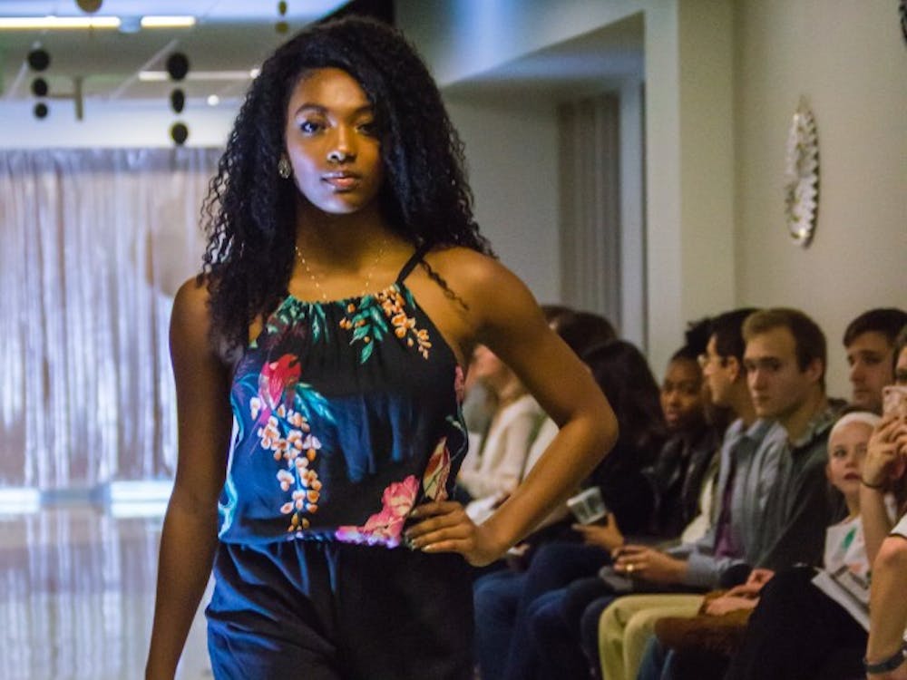 Family and friends watched the Fashion Design Soceity host a fashion show on April 1 in the Applied Technology Building. Since 1997, the organization helps fashion students develop their skills. Terence K. Lightning Jr. // DN