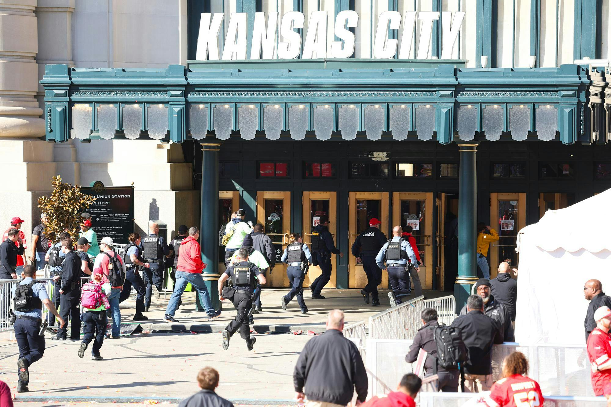 KANSAS CITY, MISSOURI - FEBRUARY 14: Law enforcement and medical personnel respond to a shooting at Union Station during the Kansas City Chiefs Super Bowl LVIII victory parade on February 14, 2024 in Kansas City, Missouri. Several people were shot and two people were detained after a rally celebrating the Chiefs Super Bowl victory. (Photo by Jamie Squire/Getty Images)