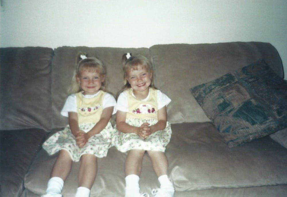 Caitlynn and Courtney Edon pose for a photo as children  at their home. PHOTO PROVIDED BY THE EDON FAMILY