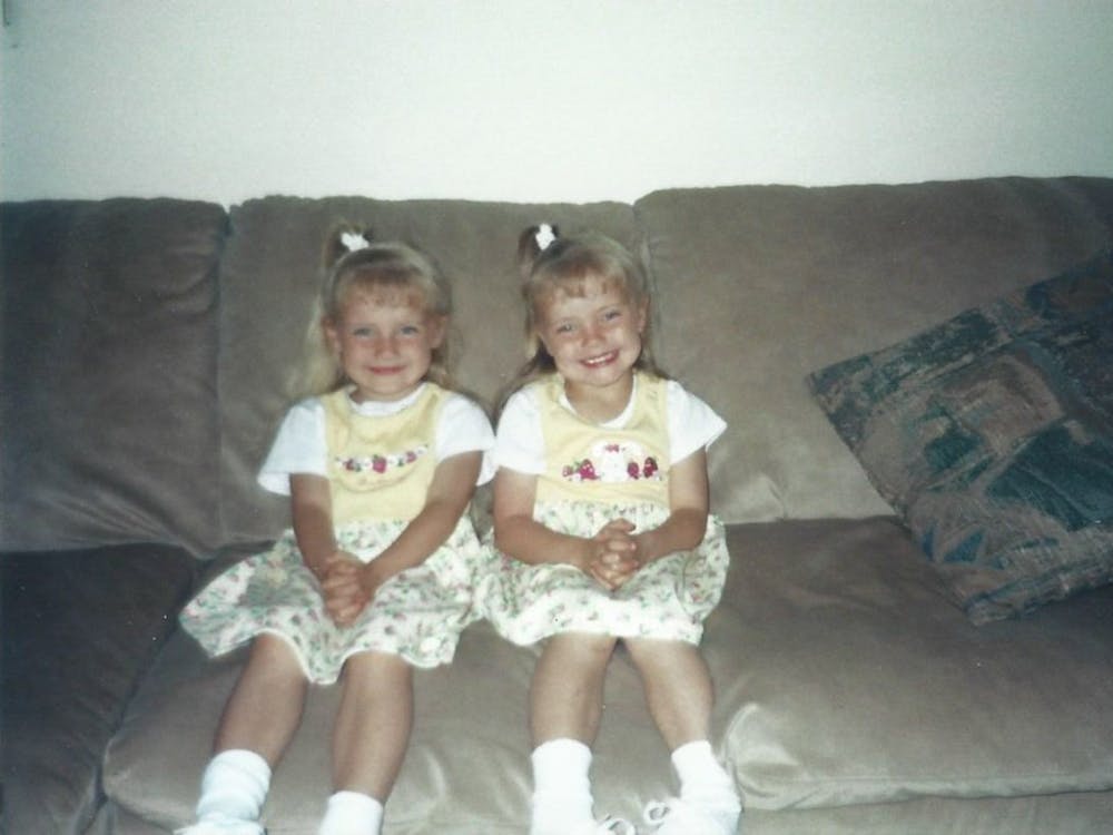 Caitlynn and Courtney Edon pose for a photo as children  at their home. PHOTO PROVIDED BY THE EDON FAMILY