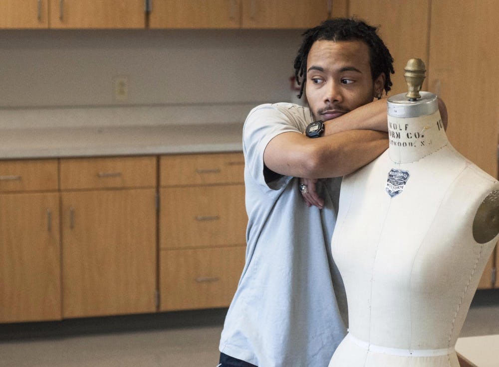 Christopher Atkinson, Ball State fashion design student, takes a moment to think about his upcoming clothing line on November 23, 2015 in Muncie, Indiana. (McKenzie Price - JOUR 235)