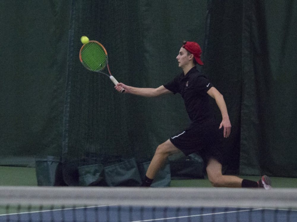 Ball State men’s tennis player Chris Adams runs to return the ball during a singles set against Eastern Illinois University on Jan. 20 at the Northwest YMCA of Muncie. Briana Hale, DN