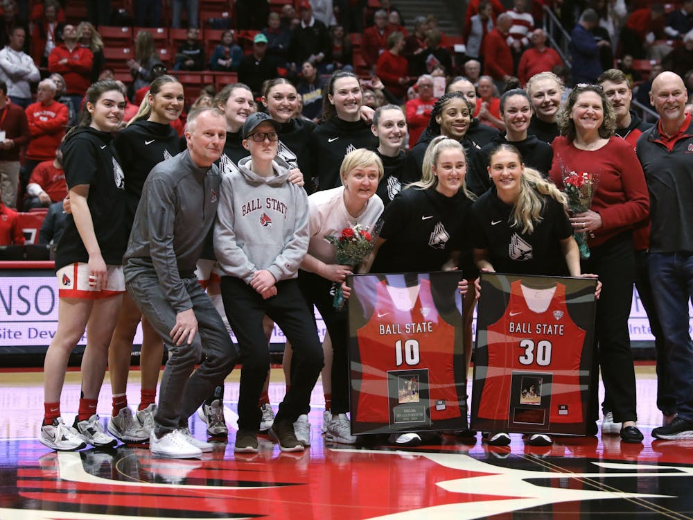 The Ball State Women's Basketball team poses for a photo with graduate student Thelma Dis Agustsdottir and redshirt-senior Anna Clephane for Senior Day before a game against Toledo Feb. 25 at Worthen Arena. Amber Pietz, DN