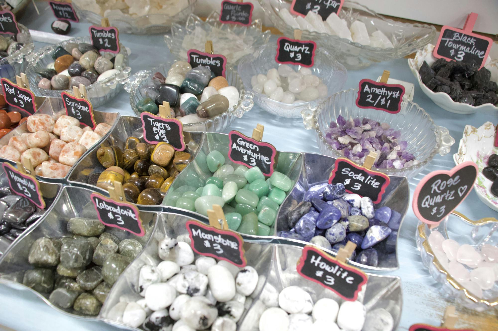 Kat’s Crystals & Curiosities has satin spar wands, raw black tourmaline, crystal chips and hearts, as well as the popular tumbled crystals Jan. 17 at Kat’s Crystals and Curiosities. Each item is marked correctly with the name and price available. Ellie Marker, DN