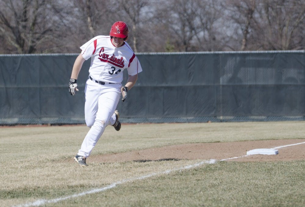 Freshman first baseman Caleb Stayton runs to home base in the March 21 game against Bowling Green at Ball Diamond. Ball State