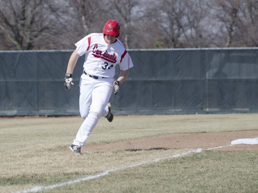 Freshman first baseman Caleb Stayton runs to home base in the March 21 game against Bowling Green at Ball Diamond. Ball State