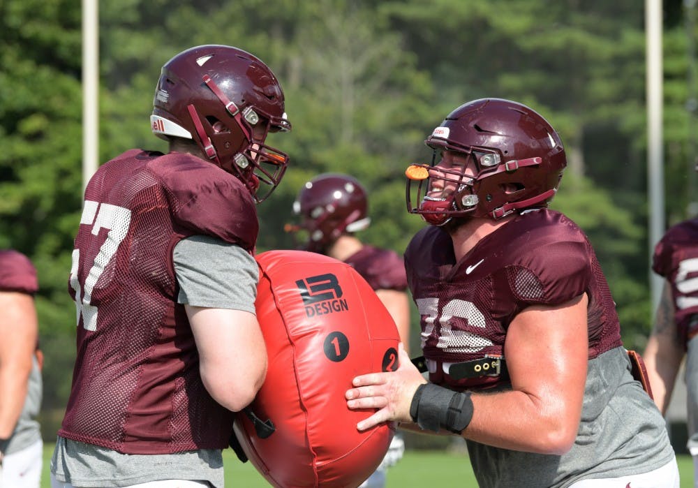 <p>Brock Hoffman works out at a football practice at Virginia Tech. &nbsp;Hoffman transferred to Virginia Tech earlier this year to be closer to his mother who had surgery to remove a brain tumor. Virginia Tech Athletics, Photo Provided</p>