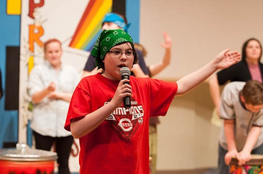 Carter Tharp performs a part of Eminem’s “Not Afraid” during a rehearsal of the Prism Project on Sunday. The event gave children a chance to perform on stage and to advance their social skills. DN PHOTO TAYLOR IRBY