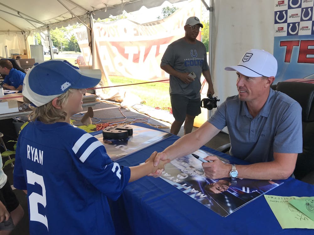 As a part of Kia of Muncie and Toyota of Muncie's Tent Sale, Indianapolis Colts quarterback Matt Ryan signed autographs from 2-4 p.m. July 22, 2022. A food truck, local radio station 104.1WLBC and more were present during said autograph signing that saw fans stretch from nearly one end of the Scheumann Stadium parking lot to the other. (Kyle Smedley/DN)