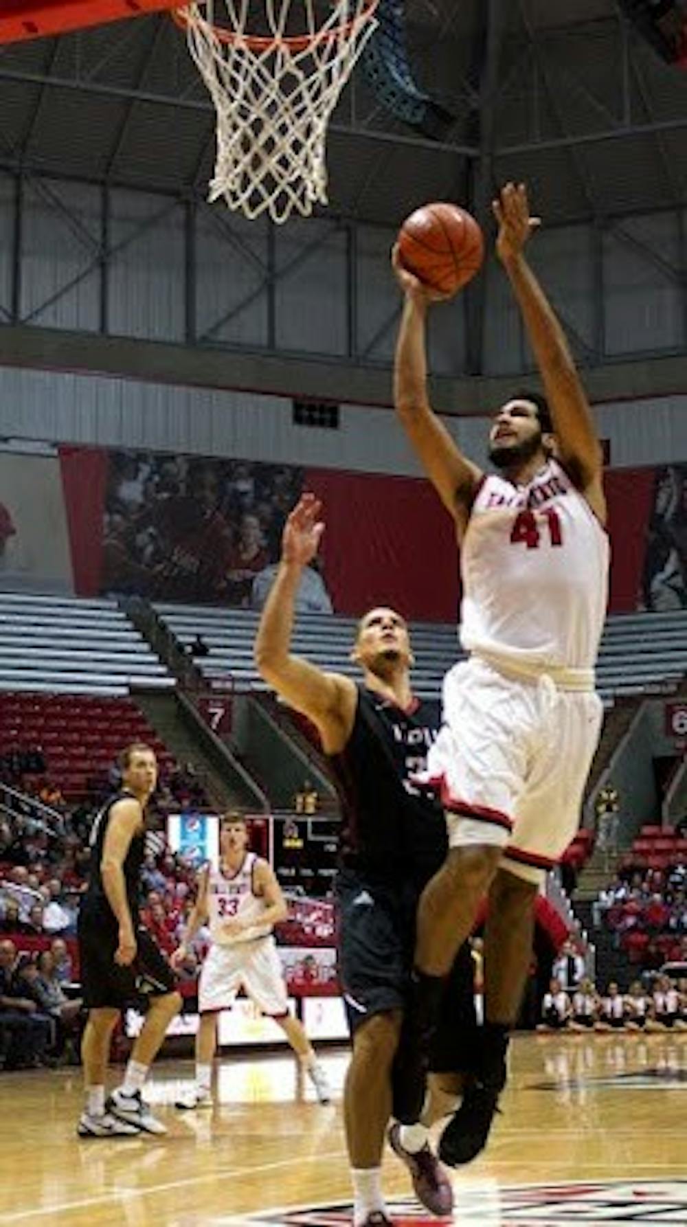 <p>Trey Moses, a freshman forward center for the Ball State Cardinals, attempts to score a layup during the game against IUPUI on Dec. 1 in John E.&nbsp;Worthen Arena. <em>Grace Ramey // DN File</em></p>