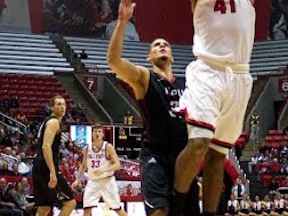 Trey Moses, a freshman forward center for the Ball State Cardinals, attempts to score a layup during the game against IUPUI on Dec. 1 in John E.&nbsp;Worthen Arena. Grace Ramey // DN File