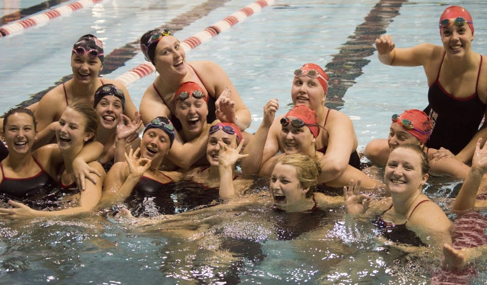 Members of the Ball State women's swimming and diving team celebrating after the Red/White Intrasquad meet on Oct. 10&nbsp;at Lewellen Aquatic Center. DN PHOTO TERENCE LIGHTNING