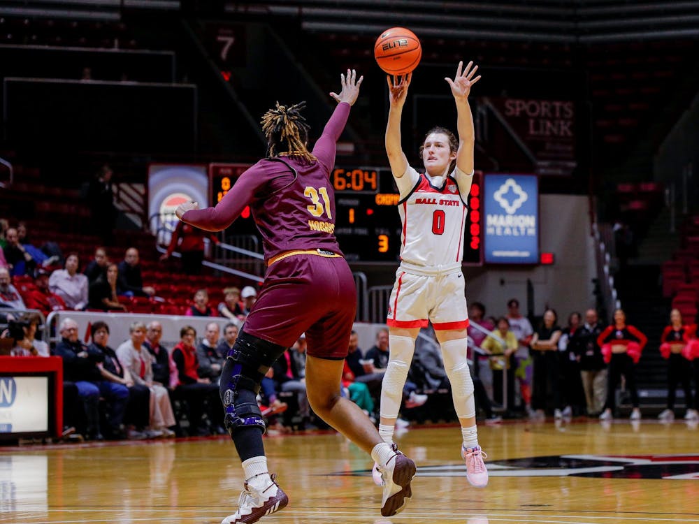 Junior Ally Becki takes a 3-pointer against Central Michigan Feb. 21 at Worthen Arena. Ball State led Central Michigan 46-21 at half. Andrew Berger, DN 