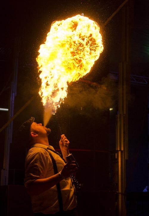 One member of Muncie’s Burn Mob blows a ball of fire into the air. Burn Mob worked with three different disc jockeys to provided the entertainment for Neely Fest. DN FILE PHOTO COREY OHLENKAMP