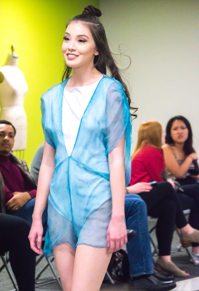 Family and friends watched the Fashion Design Soceity host a fashion show on April 1 in the Applied Technology Building. Since 1997, the organization helps fashion students develop their skills. Teri Lightning Jr., DN