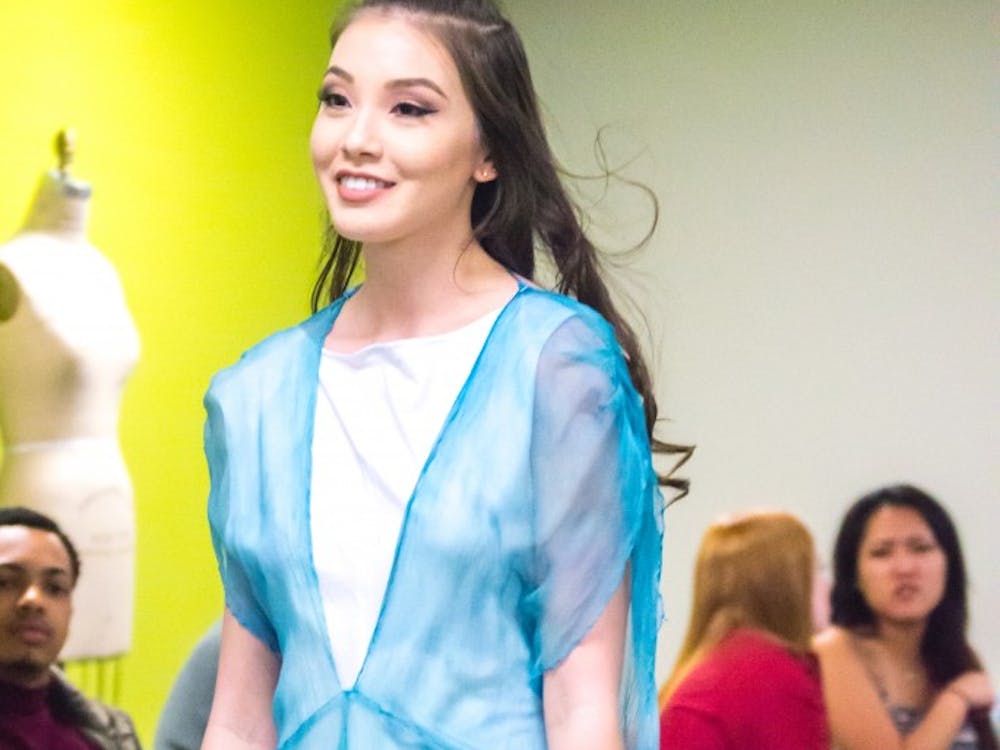 Family and friends watched the Fashion Design Soceity host a fashion show on April 1 in the Applied Technology Building. Since 1997, the organization helps fashion students develop their skills. Terence K. Lightning Jr. // DN