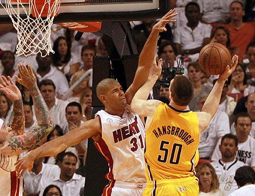 The Miami Heat’s Shane Battier blocks the shot of the Indiana Pacers’ Tyler Hansbrough in the second quarter in Game 1 of the Eastern Conference finals. The Heat won the game in overtime 103-102. MCT PHOTO