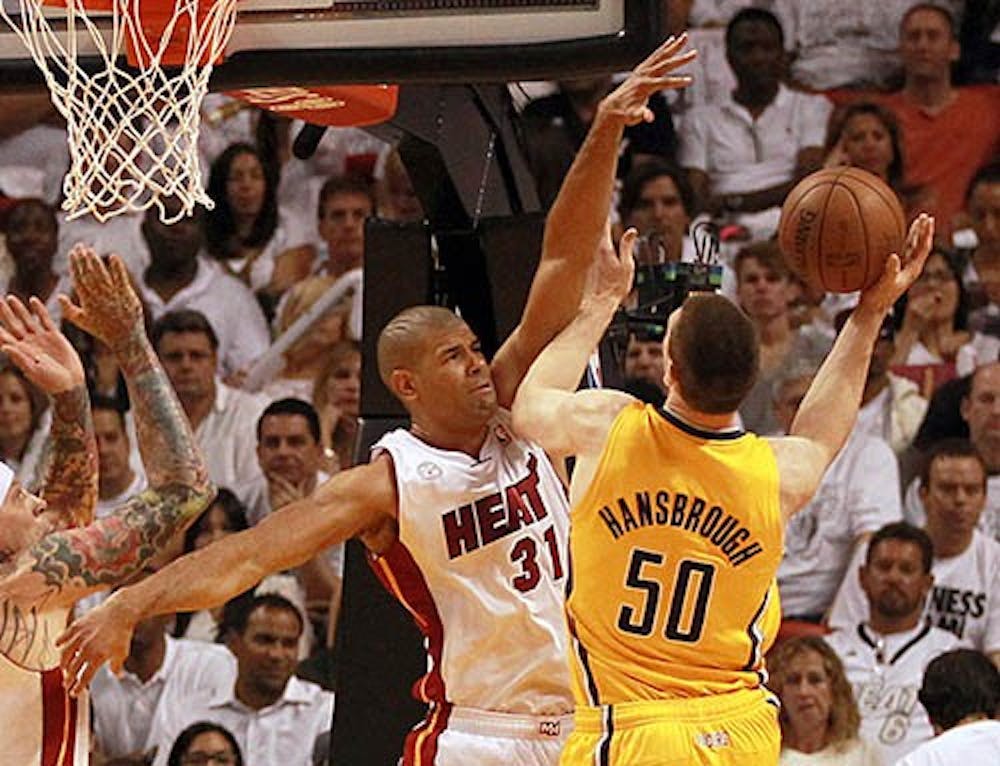 The Miami Heat’s Shane Battier blocks the shot of the Indiana Pacers’ Tyler Hansbrough in the second quarter in Game 1 of the Eastern Conference finals. The Heat won the game in overtime 103-102. MCT PHOTO