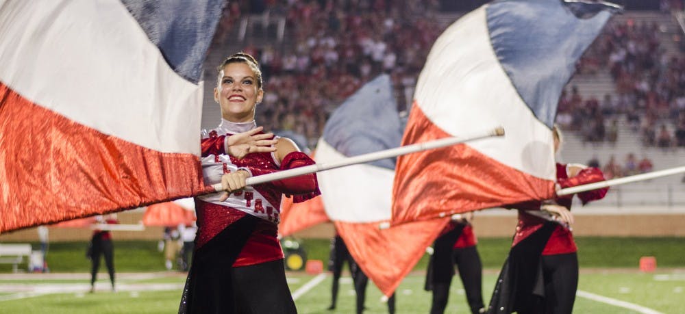 The Pride of Mid-America performs at half time of the game against Virginia Military Institute on Sept. 3 at Scheumann Stadium. DN PHOTO BREANNA DAUGHERTY