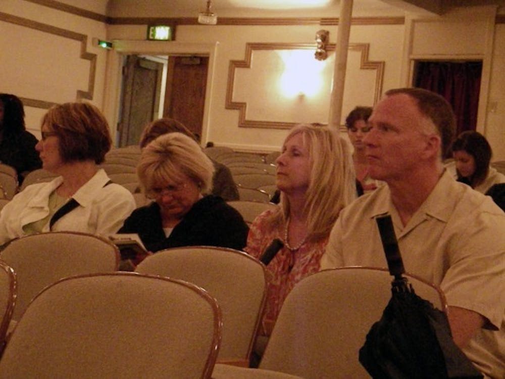 Parents at their orientation enjoy a visit to Muncie Civic Theatre and listen to Todd Sandman give a brief history of the theatre and its connections to Ball State. This is one of many stops the parents took in the downtown area. DN PHOTO LOGAN WINSLOW